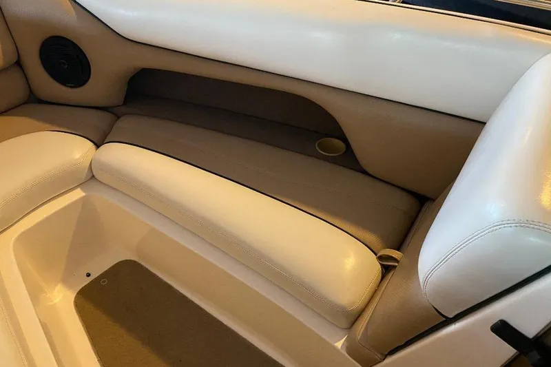 Slide: The Image of 2001 Malibu Sunscape 25 LSV boat interior with beige and white seating. - 14