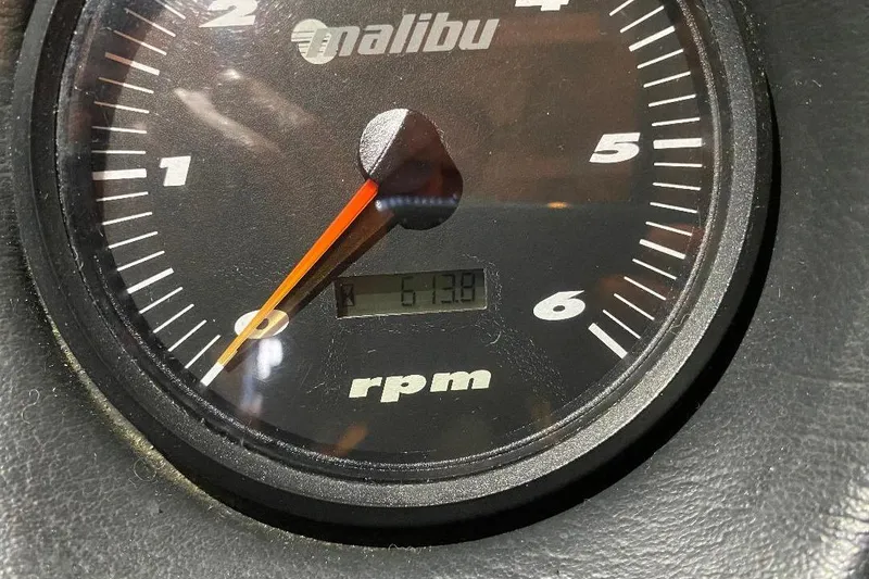 Slide: The Image of Close-up of a 2001 Malibu Sunscape 25 LSV tachometer showing 613.8 RPM. - 23