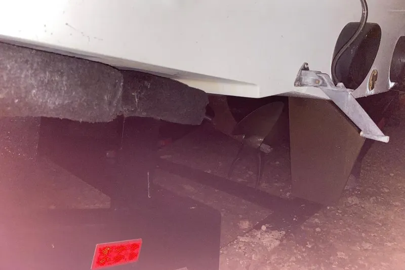 Slide: The Image of Rear view of a 2001 Malibu Sunscape 25 LSV boat on a trailer. - 7