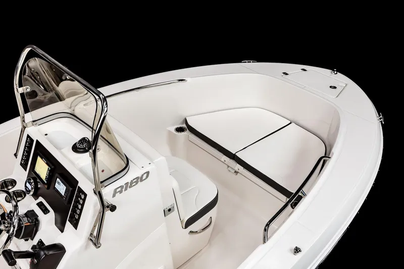 Slide: The Image of Manufacturer Provided Image: 2025 Robalo R180 Center Console boat cruising on open water. - 4