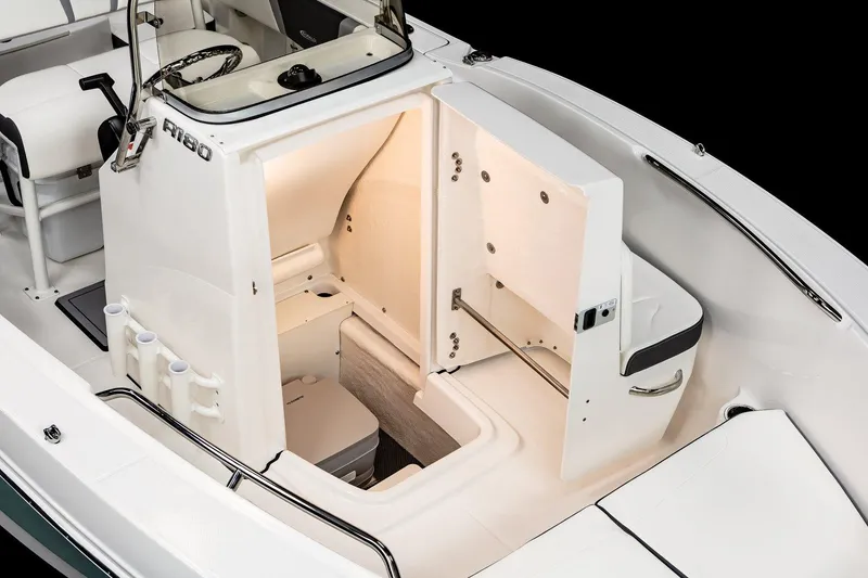 Slide: The Image of Manufacturer Provided Image: 2025 Robalo R180 Center Console boat on calm water with two people onboard. - 5