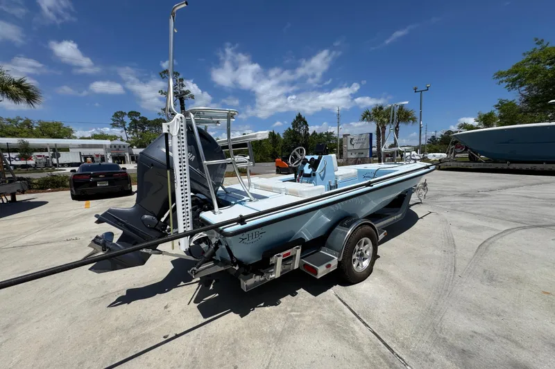 Slide: The Image of 2016 Hell's Bay Marquesa boat on trailer under clear blue sky. - 11