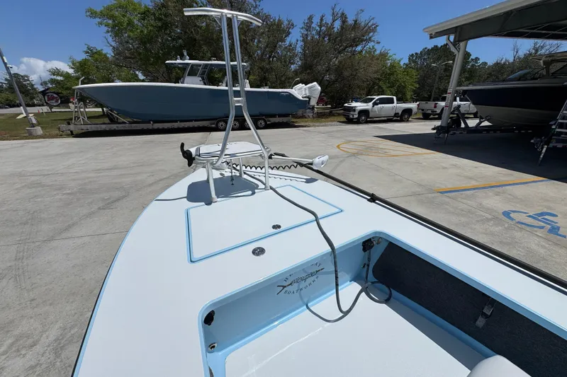 Slide: The Image of 2016 Hell's Bay Marquesa boat on trailer in sunny outdoor setting. - 20