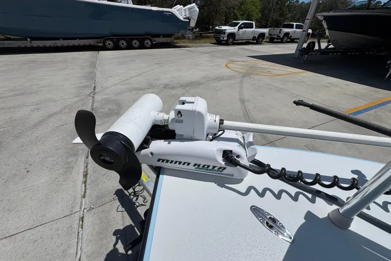 Slide: The Image of Minn Kota trolling motor on 2016 Hell's Bay Marquesa boat, parked in marina. - 22