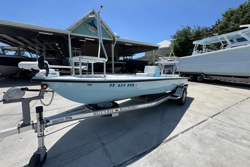 Slide: The Image of 2016 Hell's Bay Marquesa boat on trailer in marina setting. - 3