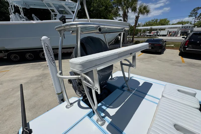 Slide: The Image of 2016 Hell's Bay Marquesa boat with Power-Pole, parked outdoors under clear skies. - 38