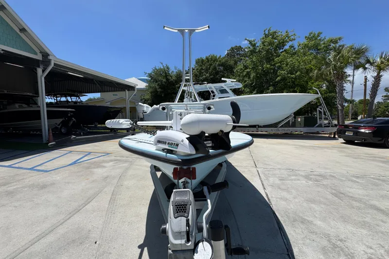 Slide: The Image of 2016 Hell's Bay Marquesa boat on trailer in sunny outdoor setting. - 5