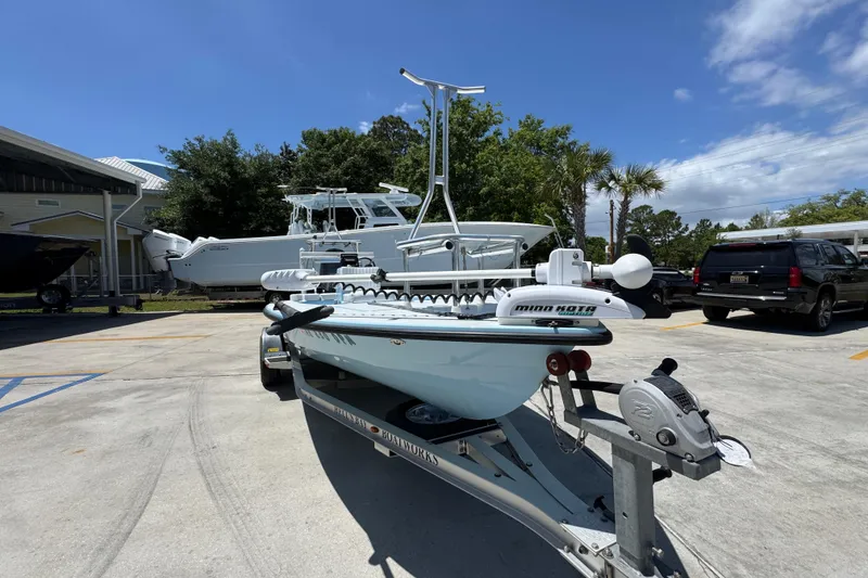 Slide: The Image of 2016 Hell's Bay Marquesa boat on trailer in sunny outdoor setting. - 6