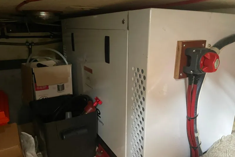 Slide: The Image of Engine room of 1979 Albin 36 Trawler with equipment and storage boxes. - 13