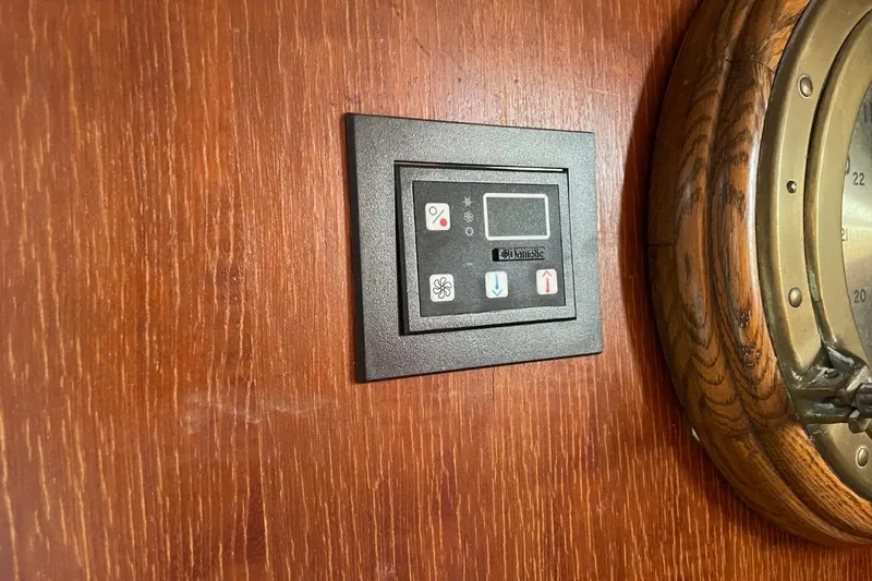 Slide: The Image of Control panel on 1979 Albin 36 Trawler's wooden interior wall. - 14