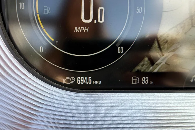 Slide: The Image of Dashboard of 2020 MasterCraft X22 showing 694.5 hours and 93% fuel level. - 12