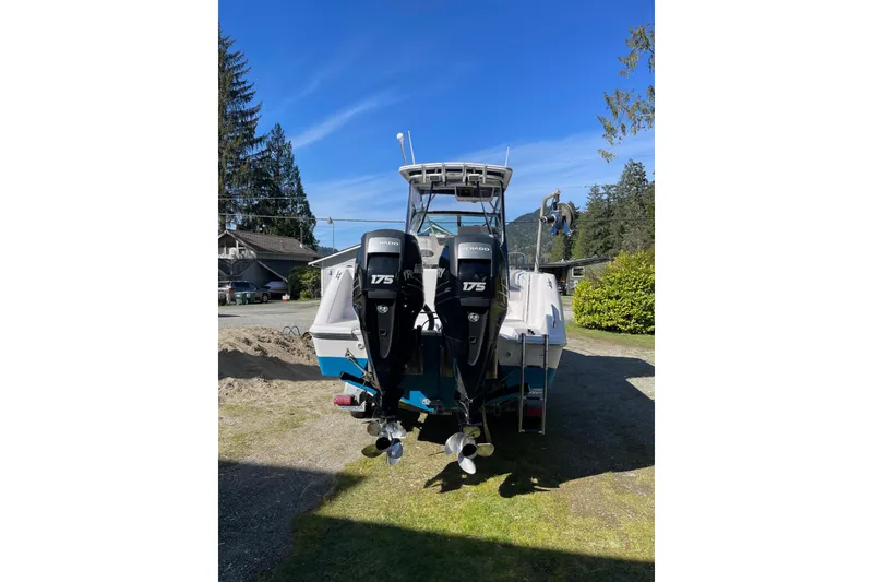 Slide: The Image of 2002 Pro-Line 260 Walkaround boat with dual 175 horsepower outboard motors. - 2