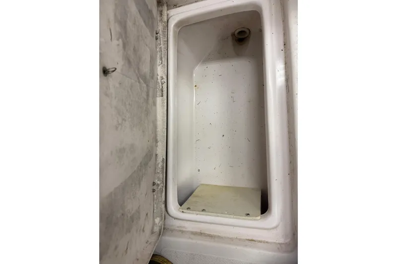 Slide: The Image of Empty storage compartment in 2002 Pro-Line 260 Walkaround boat. - 22