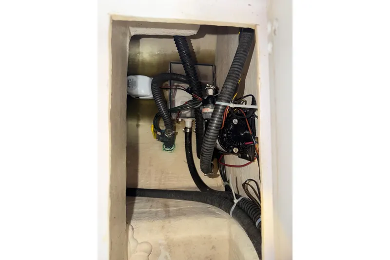Slide: The Image of 2002 Pro-Line 260 Walkaround boat interior wiring and plumbing components. - 46