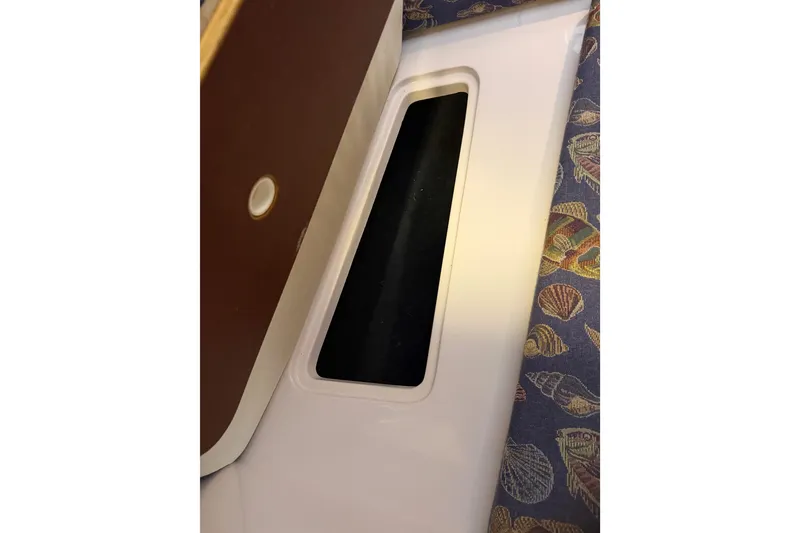 Slide: The Image of Interior detail of a 2002 Pro-Line 260 Walkaround boat with patterned upholstery. - 52