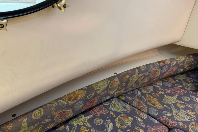Slide: The Image of Interior of 2002 Pro-Line 260 Walkaround with patterned marine upholstery. - 55