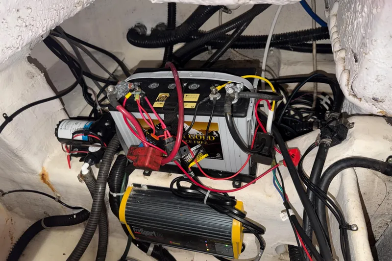 Slide: The Image of Battery and wiring setup in a 2002 Pro-Line 260 Walkaround boat. - 64