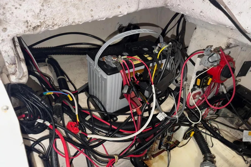 Slide: The Image of Battery and wiring setup in a 2002 Pro-Line 260 Walkaround boat. - 66