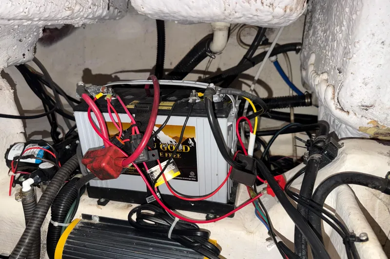 Slide: The Image of Battery setup in a 2002 Pro-Line 260 Walkaround boat, featuring wiring and connections. - 68