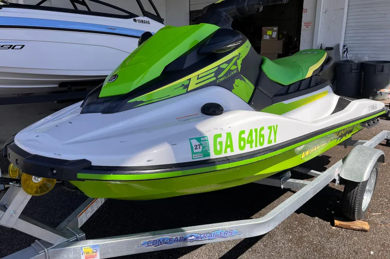 The Image of 2021 Yamaha WaveRunner EX Deluxe in green on trailer, parked outdoors. - 0