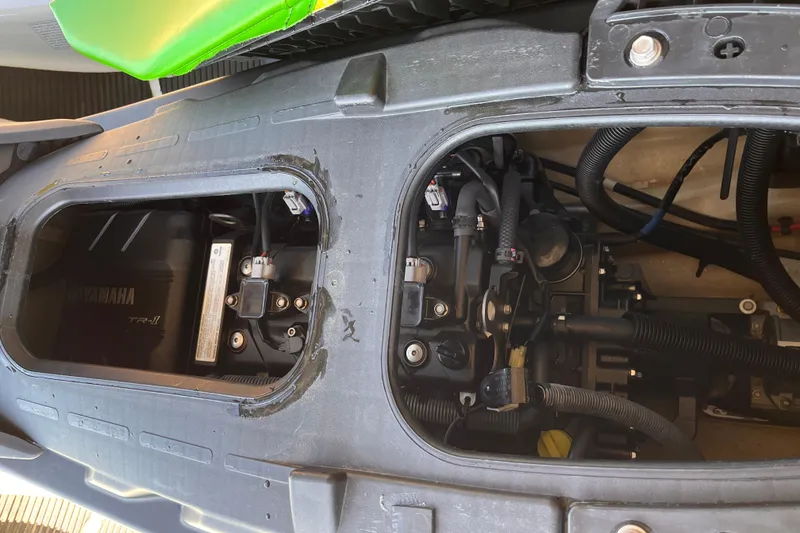 Slide: The Image of 2021 Yamaha WaveRunner EX Deluxe engine compartment, showcasing internal components and wiring. - 4