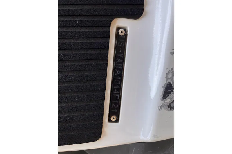 Slide: The Image of 2021 Yamaha WaveRunner EX Deluxe hull identification number on white surface. - 9