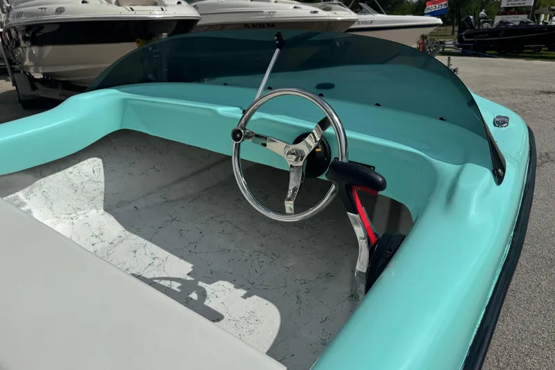 Slide: The Image of Interior of a vintage 1959 Redfish 14 Shark boat with turquoise accents. - 7