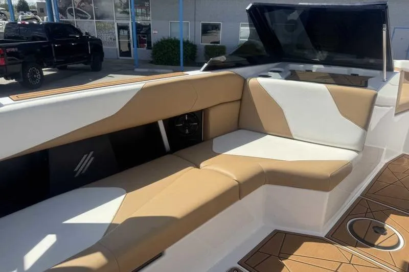Slide: The Image of 2021 ATX Type 22s boat interior with tan and white seating. - 12