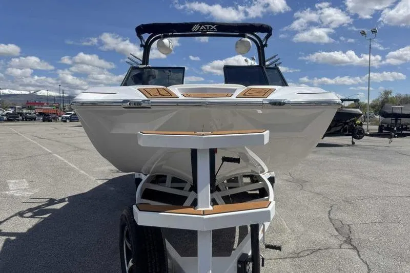 Slide: The Image of 2021 ATX Type 22s boat on trailer under a clear blue sky. - 13