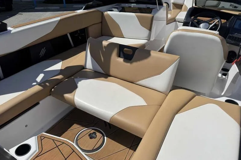 Slide: The Image of Interior of 2021 ATX Type 22s boat with tan and white seating. - 17