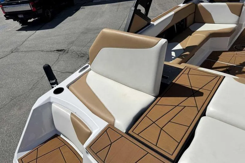 Slide: The Image of 2021 ATX Type 22s boat interior with tan and white seating, geometric flooring. - 3