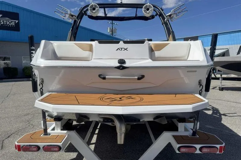 Slide: The Image of Rear view of 2021 ATX Type 22s boat with teak deck and wakeboard tower. - 5