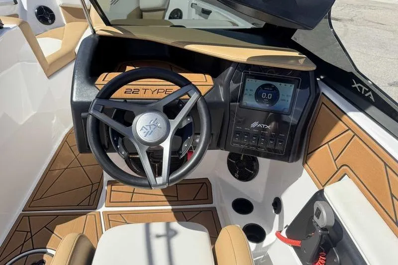 Slide: The Image of ATX Type 22s 2021 boat dashboard with steering wheel and digital display. - 6