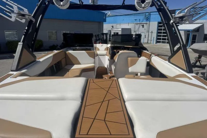 Slide: The Image of 2021 ATX Type 22s boat interior with tan and white seating, modern design. - 8