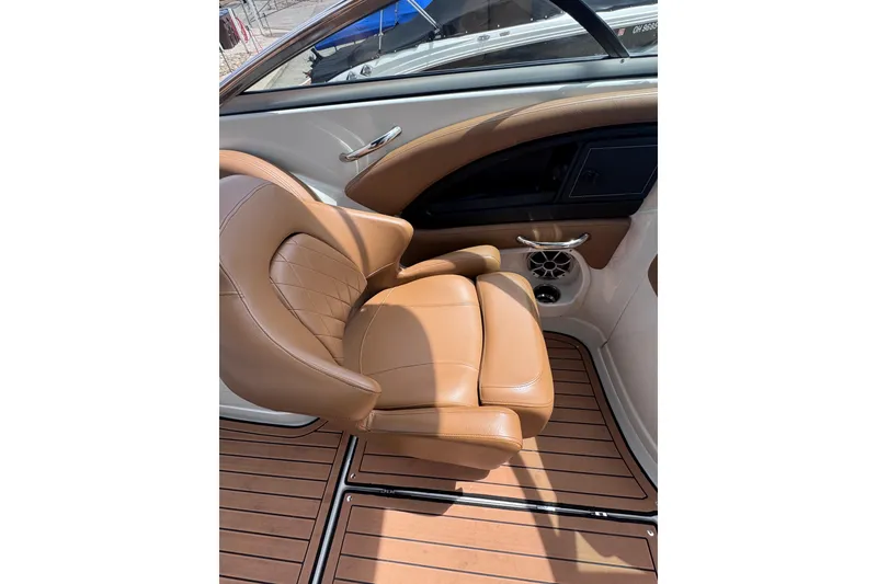Slide: The Image of Luxurious tan leather seat in 2025 Crownline Eclipse E235 boat interior. - 20