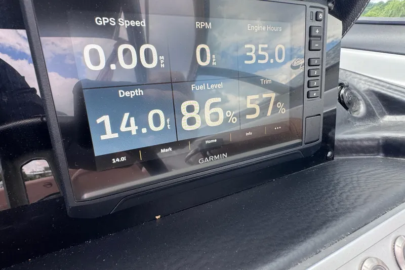 Slide: The Image of Garmin display on 2025 Crownline Eclipse E235 showing GPS speed, depth, fuel level, and trim. - 22