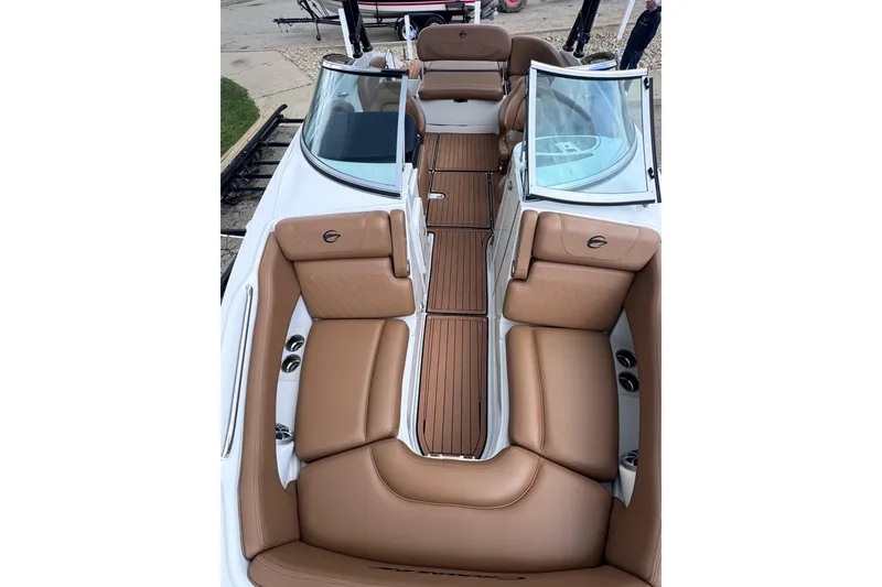 Slide: The Image of 2025 Crownline Eclipse E235 boat interior with tan leather seating and sleek design. - 35