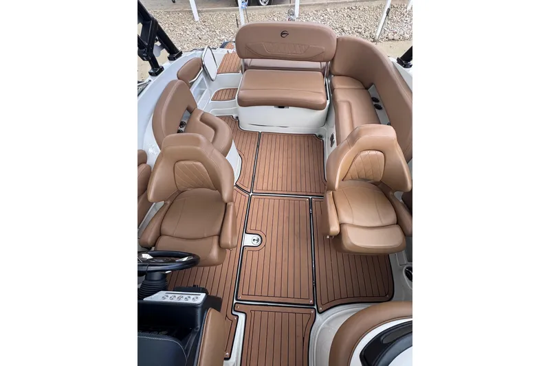 Slide: The Image of Luxurious interior of 2025 Crownline Eclipse E235 boat with tan leather seating. - 36