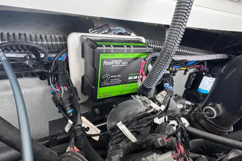 Slide: The Image of Battery charger setup in 2025 Crownline Eclipse E235 boat engine compartment. - 39