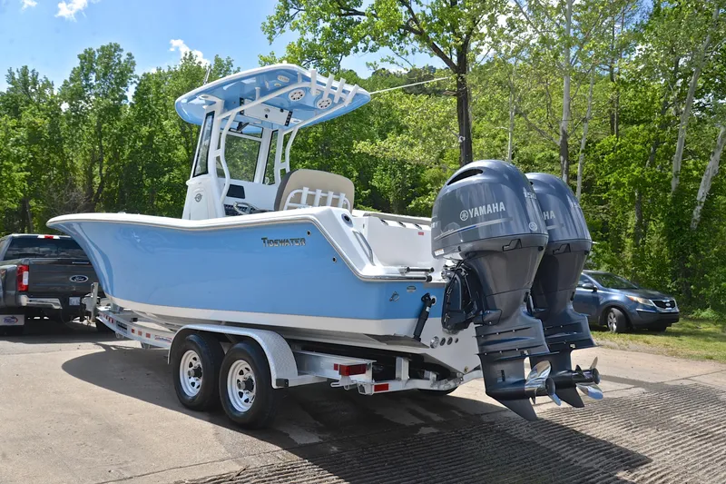Slide: The Image of 2021 Tidewater 256 CC Adventure boat on trailer with twin Yamaha engines. - 13