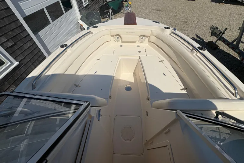 Slide: The Image of 2017 Grady-White Freedom 235 boat interior with seating and storage compartments. - 10