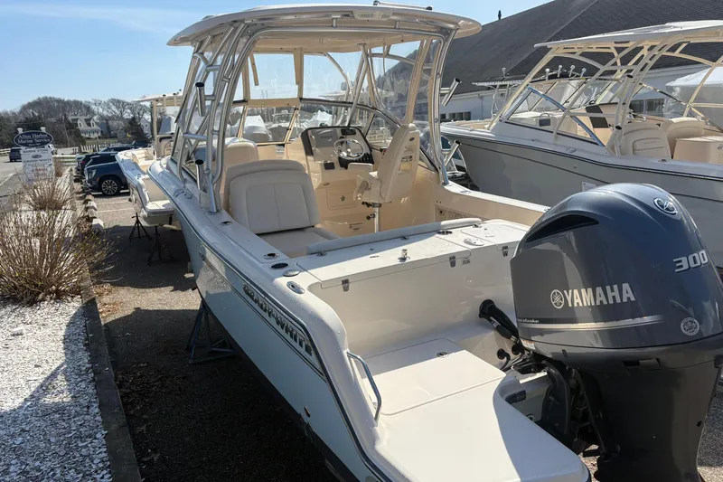 Slide: The Image of 2017 Grady-White Freedom 235 boat with Yamaha 300 engine, docked outdoors. - 11