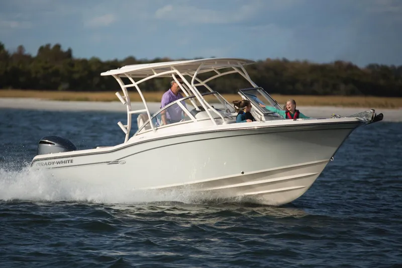 Slide: The Image of Manufacturer Provided Image: 2017 Grady-White Freedom 235 boat cruising on water with passengers. - 12