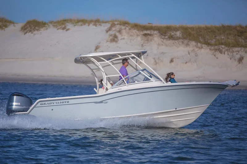 Slide: The Image of Manufacturer Provided Image: 2017 Grady-White Freedom 235 boat cruising near sandy shore. - 13