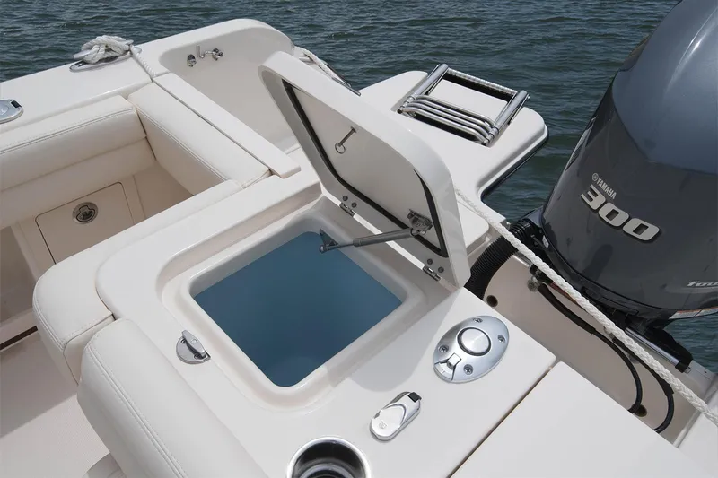 Slide: The Image of Manufacturer Provided Image: 2017 Grady-White Freedom 235 boat with open storage compartment and Yamaha 300 engine. - 18