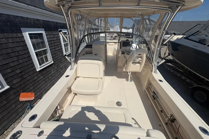 Slide: The Image of 2017 Grady-White Freedom 235 boat interior with seating and helm station. - 4