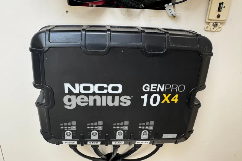 Slide: The Image of NOCO Genius GENPRO 10X4 charger in a 2006 Pursuit 3480 Center Console boat. - 16