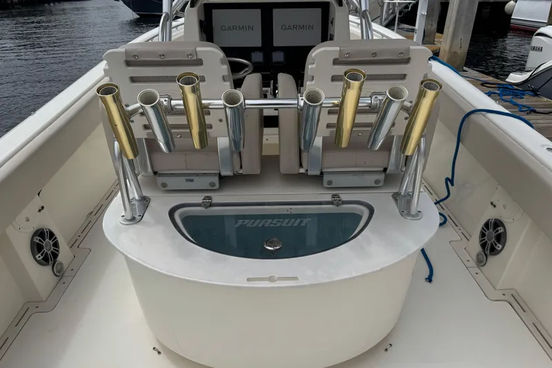 Slide: The Image of 2006 Pursuit 3480 Center Console boat with rod holders and Garmin electronics. - 4