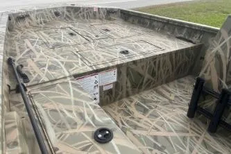 Slide: The Image of 2026 Crestliner 1760 Retriever SC boat with camouflage design, featuring spacious deck layout. - 10