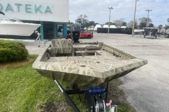 Slide: The Image of 2026 Crestliner 1760 Retriever SC boat on trailer outside dealership. - 3
